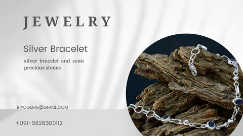 Elegant silver bracelet with semi precious stones on a textured background