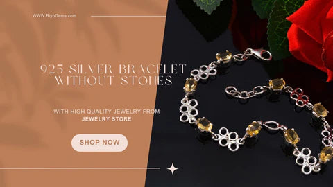 Elegant sterling silver bracelet no stones showcased on a dark surface with floral accents