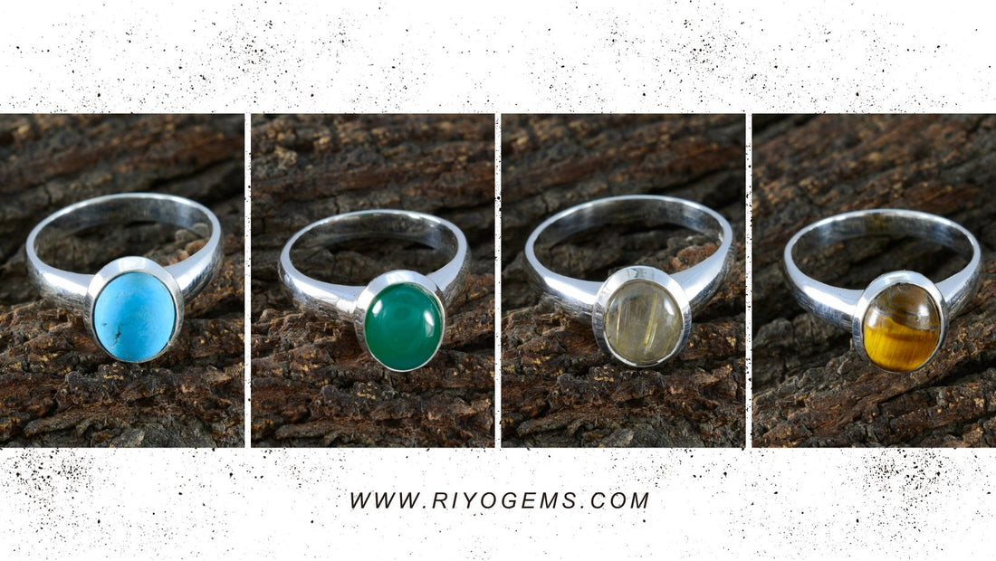 Silver rings featuring various real gemstones on a rustic wooden background