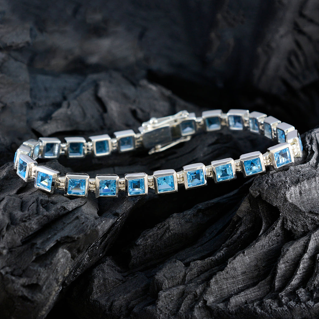 Bracelet tennis classique en argent sterling et topaze bleue