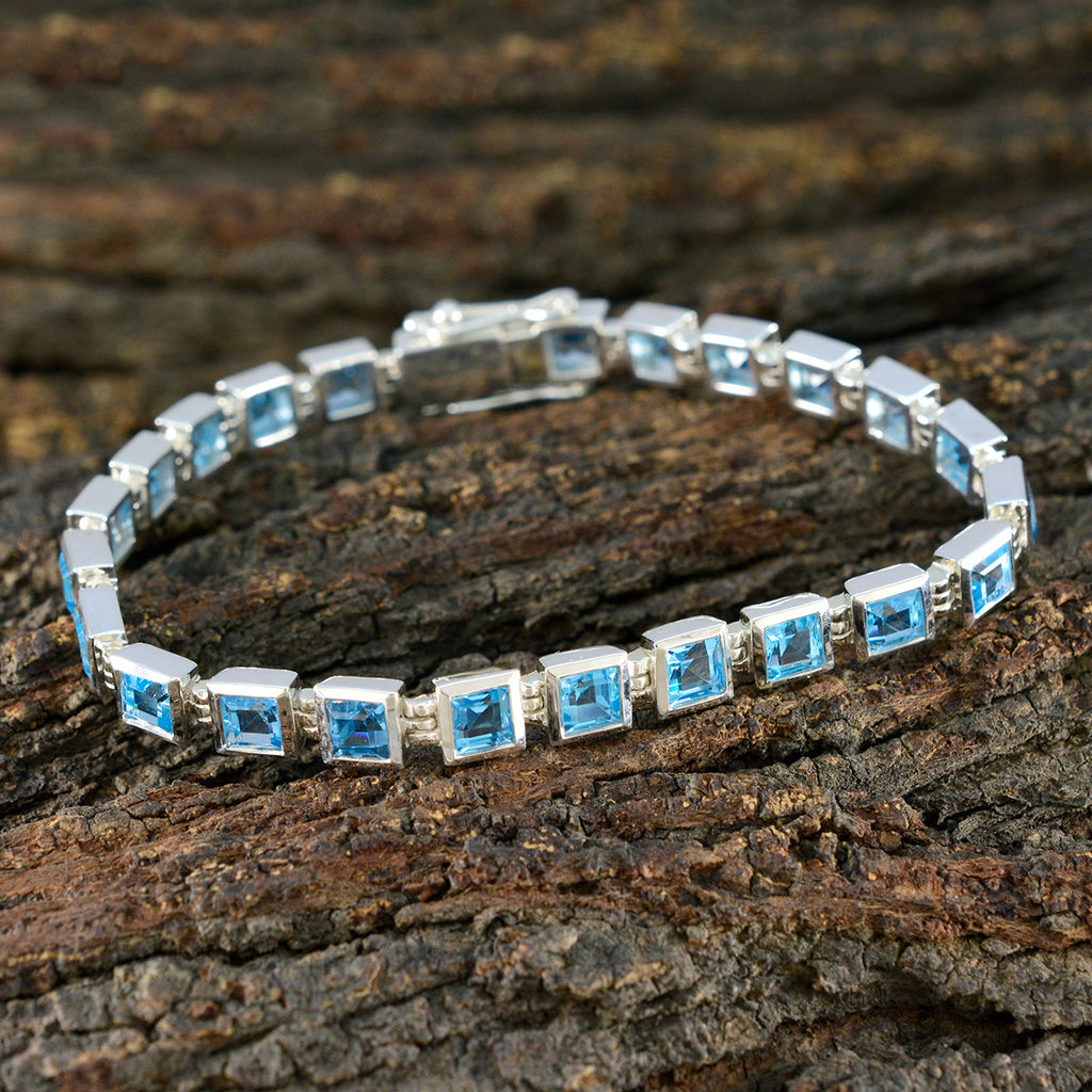 Bracelet tennis classique en argent sterling et topaze bleue