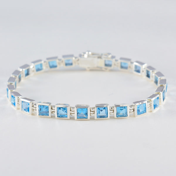 Bracelet tennis classique en argent sterling et topaze bleue