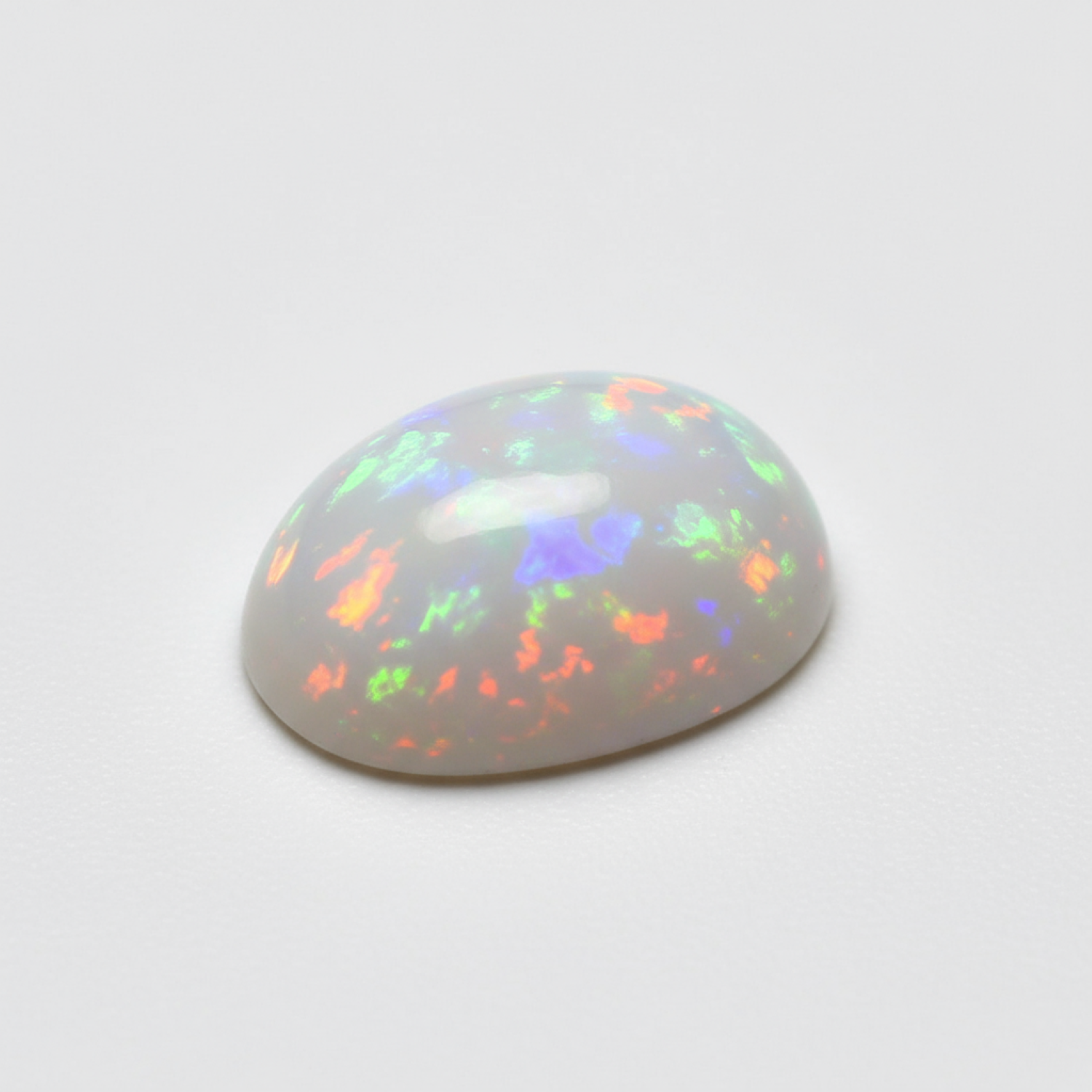 Created Opal 1PC Small 7x9 MM Oval Cabochon White Pure semi Precious Loose Gems Imagen principal del producto