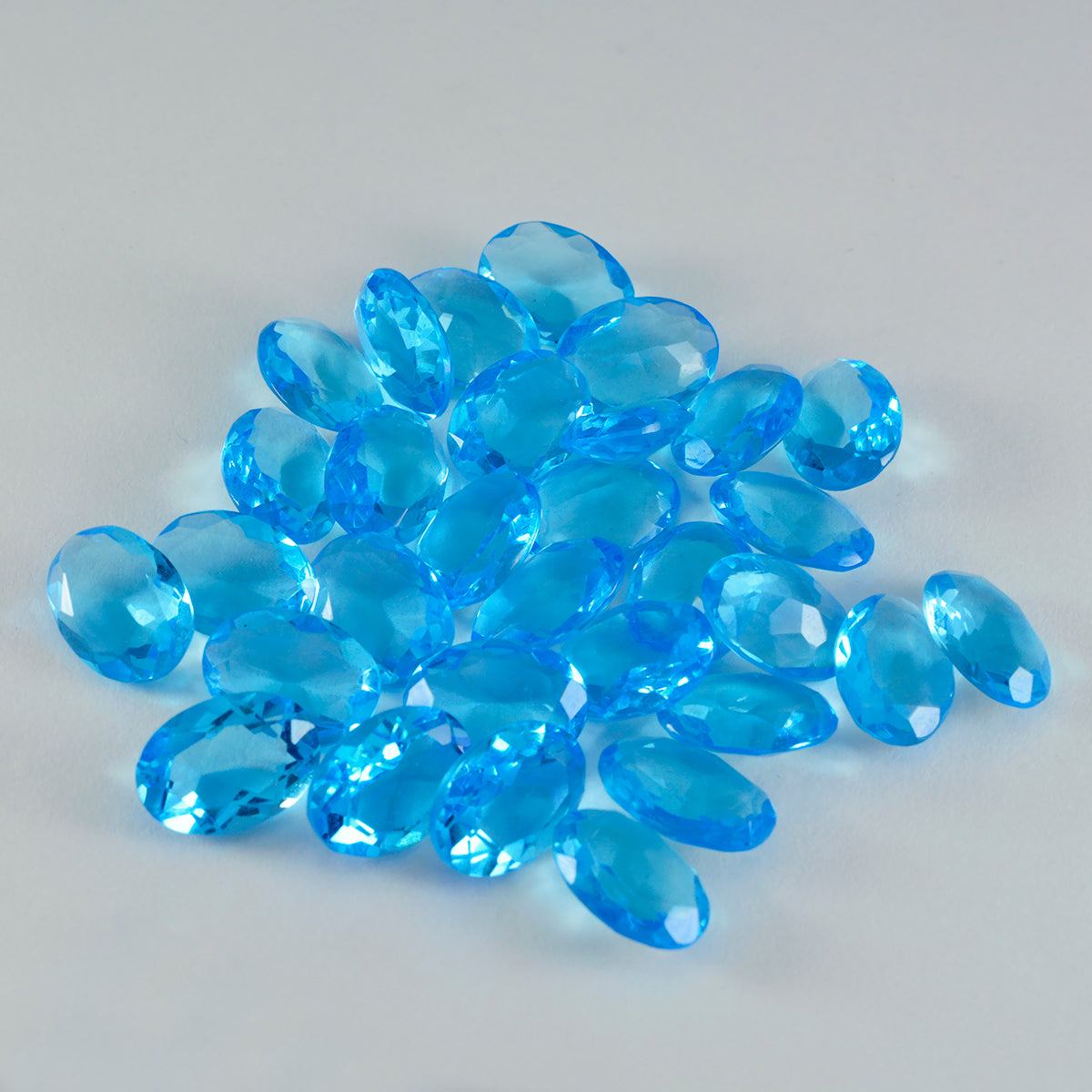 Riyogems 1 Stück blauer Topas, CZ, facettiert, 7 x 9 mm, ovale Form, wunderschöner Qualitäts-Edelstein